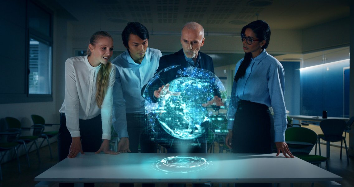 stock-photo-a-group-of-designer-are-using-a-futuristic-sophisticated-technology-screen-with-augmented-reality-1545542432.jpg
